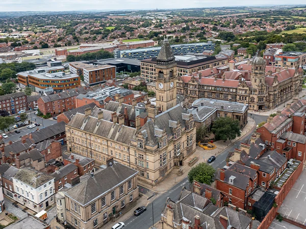 Aerial view of historic city buildings and streets.