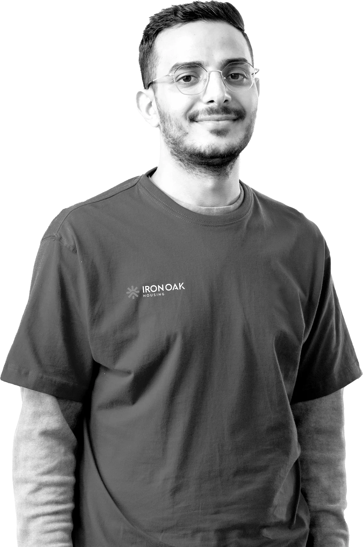 Smiling person wearing Iron Oak t-shirt with glasses.